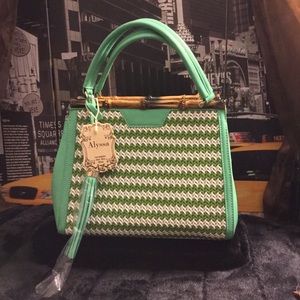 Mint and white woven vegan leather handbag